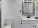 Bright bathroom with a white vanity, modern fixtures, and neutral decor at 8012 S Cedar St, Littleton, CO 80120