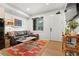 Cozy living room featuring a modern sofa, bright rug, and natural light with views of the community at 2115 Hummingbird Way # 105, Georgetown, CO 80444