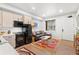 Well-lit living area with a modern sofa, functional kitchen, and stylish decor in a contemporary layout at 2115 Hummingbird Way # 105, Georgetown, CO 80444
