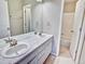 Bathroom with double sinks, a tub, and shower at 9711 Millstone Ct, Highlands Ranch, CO 80130