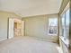 Bedroom with window, access to upper floor at 9711 Millstone Ct, Highlands Ranch, CO 80130