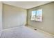 Bright bedroom with carpet and a window at 9711 Millstone Ct, Highlands Ranch, CO 80130