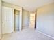 Spacious bedroom with closet and access to upper floor at 9711 Millstone Ct, Highlands Ranch, CO 80130