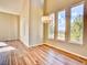 Bright dining room with large windows, chandelier, and wood-look floors at 9711 Millstone Ct, Highlands Ranch, CO 80130