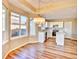 Open kitchen with white cabinets, stainless steel appliances, and large windows for natural light at 9711 Millstone Ct, Highlands Ranch, CO 80130