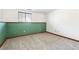 Image of empty room; carpeted with painted green on the bottom half of the walls at 1101 E 7Th Avenue Cir, Broomfield, CO 80020