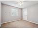 Bright bedroom features neutral walls, a window for natural light, and a carpeted floor at 1101 E 7Th Avenue Cir, Broomfield, CO 80020