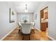 Formal dining room with hardwood floors and views into the kitchen at 1101 E 7Th Avenue Cir, Broomfield, CO 80020