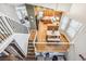 Open-concept floor plan shows the kitchen and adjacent living areas, connected by stairs with a metal railing at 1101 E 7Th Avenue Cir, Broomfield, CO 80020