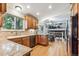 Modern kitchen with stainless steel appliances, wood cabinets, and granite countertops at 1101 E 7Th Avenue Cir, Broomfield, CO 80020