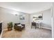 Cozy sitting area features a comfortable chair, floor lamp, desk, and a window for ample natural light at 1101 E 7Th Avenue Cir, Broomfield, CO 80020