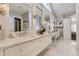 Spa-like bathroom with double vanity and a soaking tub at 1050 Buffalo Ridge Rd, Castle Pines, CO 80108