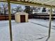 Backyard with storage shed and snow coverage at 1244 Racine St, Aurora, CO 80011