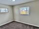 Bright bedroom with neutral walls and carpet flooring, offering ample natural light at 1244 Racine St, Aurora, CO 80011