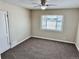 Bright bedroom with neutral walls, carpet, and a window at 1244 Racine St, Aurora, CO 80011