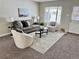 Cozy living room with a gray sofa and armchairs at 1244 Racine St, Aurora, CO 80011