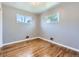 Bright bedroom with two windows and hardwood floors at 10736 Logan Ct, Northglenn, CO 80233