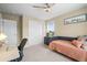 Bedroom featuring neutral walls, a daybed, closet with sliding doors and a view to the outdoors at 11631 Mobile Ct, Commerce City, CO 80022