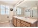 Bathroom with a double sink vanity, and a large mirror at 10460 Ketchwood Ct, Highlands Ranch, CO 80130