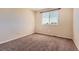Bedroom featuring a window and neutral carpet at 10460 Ketchwood Ct, Highlands Ranch, CO 80130