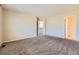 Spacious bedroom featuring a door to the ensuite and walk-in closet at 10460 Ketchwood Ct, Highlands Ranch, CO 80130