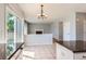 Open kitchen features granite countertops, white cabinetry, and sliding glass doors to the backyard at 10460 Ketchwood Ct, Highlands Ranch, CO 80130