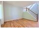 Spacious living room featuring hardwood floors and a staircase with natural light at 10460 Ketchwood Ct, Highlands Ranch, CO 80130