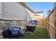 Cozy backyard with artificial turf, fire pit, and chairs at 765 N Shawnee St, Aurora, CO 80018