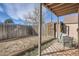 Fenced backyard features a covered patio and a wood fence at 865 S Quebec St # 104B, Denver, CO 80247