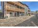 Exterior view of building with balconies and shared yard space at 865 S Quebec St # 104B, Denver, CO 80247