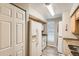 Efficient kitchen features white appliances, granite countertops, and wood cabinets at 865 S Quebec St # 104B, Denver, CO 80247