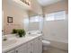 Traditional bathroom features a bath tub, double vanity, and tile flooring and countertops at 11558 Pine Hill Way, Parker, CO 80138