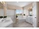 Bright bathroom featuring a walk-in shower, soaking tub with a view, and dual sink vanity at 11558 Pine Hill Way, Parker, CO 80138