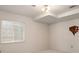 A bright bedroom featuring neutral paint and carpet, with a single window and overhead lighting at 11558 Pine Hill Way, Parker, CO 80138