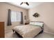 Comfortable bedroom with neutral walls and carpeting, ceiling fan, and large window at 11558 Pine Hill Way, Parker, CO 80138
