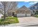 Charming home with stone accents, attached two-car garage, mature tree and inviting front porch at 11558 Pine Hill Way, Parker, CO 80138