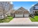 Charming home with stone accents, attached two-car garage, mature tree and inviting front porch at 11558 Pine Hill Way, Parker, CO 80138