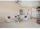 A spacious living room boasts vaulted ceilings, neutral tones, and ample natural light at 11558 Pine Hill Way, Parker, CO 80138