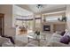 Open living space with fireplace, views and a dining area offering a bright and airy atmosphere at 11558 Pine Hill Way, Parker, CO 80138
