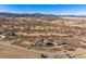 Stunning aerial view of the house and its estate surrounded by mountains in the distance at 2785 Bears Den Dr, Sedalia, CO 80135