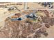 Aerial view of rustic home and barn house with a long drive and lush greenery at 2785 Bears Den Dr, Sedalia, CO 80135