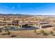 Aerial shot showcases the main house and barn house with picturesque mountain views at 2785 Bears Den Dr, Sedalia, CO 80135