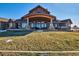 Exterior of home featuring a large back porch area perfect for outdoor entertaining at 2785 Bears Den Dr, Sedalia, CO 80135