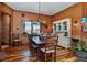 Elegant dining room features a large wooden table, rustic decor, and hardwood floors at 2785 Bears Den Dr, Sedalia, CO 80135