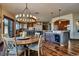 Spacious open-concept kitchen features breakfast bar, modern lighting, and rustic wood accents at 2785 Bears Den Dr, Sedalia, CO 80135