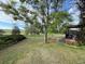 Expansive backyard with lush green grass and mature trees, offering a serene and private outdoor space at 17852 E Long Ave, Centennial, CO 80016