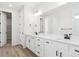 Modern bathroom with double vanity and white cabinets at 8124 Cokedale Cir, Littleton, CO 80125