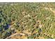 Aerial view of property lines among a beautiful tree filled lot at 24929 N Mountain Park Dr, Evergreen, CO 80439