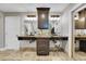 Bathroom featuring dual sinks, dark wood cabinets, and modern fixtures at 24929 N Mountain Park Dr, Evergreen, CO 80439