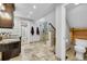 Spacious bathroom featuring a walk-in shower, dual sinks, and stone flooring at 24929 N Mountain Park Dr, Evergreen, CO 80439